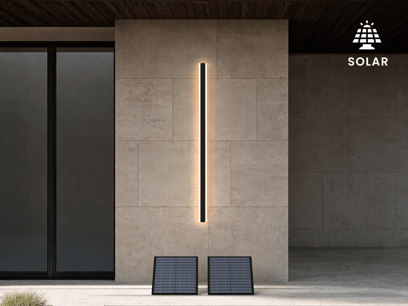 Haylen black LED bar wall light on a stone facade with two ground-mounted solar panels below