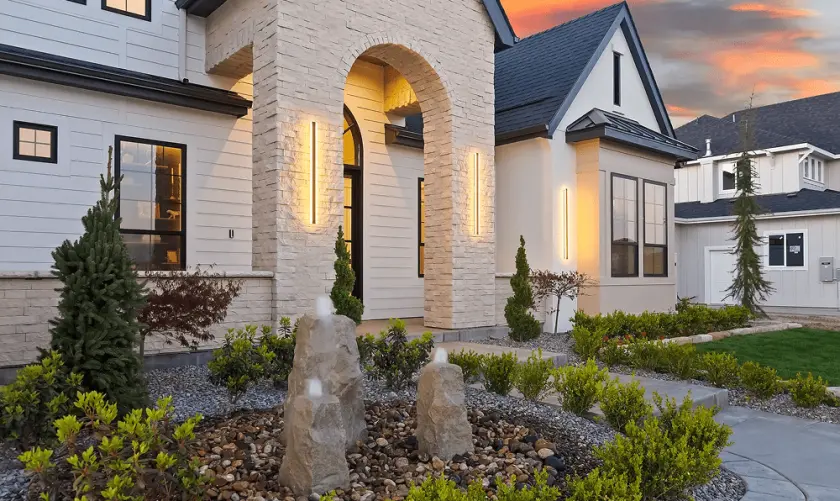 Exterior wall lighting on a modern home at dusk